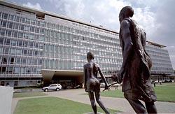 Outside the World Health Organization headquarters in Geneva, a statue of a child leading a blind man commemorates the agency's work to wipe out river blindness, a disease that is endemic in parts of Central Africa. The statue was donated by the drug company Merck.