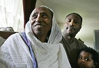 As a U.S. citizen, Laine Seleba, right, of Shoreline, petitioned to get a green card for his mother, Werku Tekle, 70, left, of Eritrea. She received it. At lower right is Seleba's son, Nathaniel.