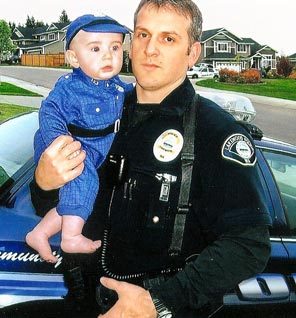 Lakewood Sgt. Mark Renninger is shown with his son, Nicholas, about two years ago. 