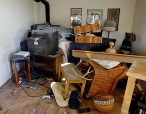 Tear-gas residue and tossed furniture are everywhere in the Leschi home of Maurice Clemmons' aunt, Chrisceda Clemmons, and her husband, Michael Shantz. 