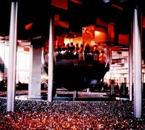 The Bubbleator, a spherical glass elevator, took World of Tomorrow visitors at the Coliseum up into a "cloud" of 3,200 aluminum cubes showing a multimedia spectacle, "The Threshold and the Threat," with sights and sounds coming from all sides. In the presentation, the threat of nuclear war appears suddenly, and a family is portrayed in a fallout shelter. At the end, passengers hear part of President John F. Kennedy's inaugural speech in which he called for everyone to use the knowledge of the present to build a brighter future.