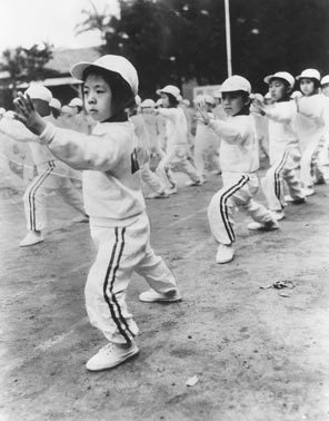 Young performers from Taiwan's touring Foo-Hsing Theater practice their gymnastics routines before putting on a show at the Opera House in October 1962.