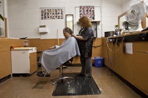 BARBER SHOP: Chris Cantley, a resident, gets a haircut in the commitment center. 