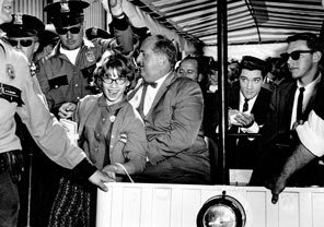 It was fitting that a World's Fair celebrating space exploration would attract the biggest star of the time — Elvis Presley, who was in town to film "It Happened at the World's Fair." Here he is surrounded by police and autograph-seeking fans. 