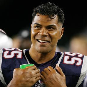 Junior Seau #55 of the New England Patriots smiles from the sidelines as his team plays the Arizona Cardinals in 2006. According to reports today, Seau, 43, was found dead in his home in Oceanside, California.