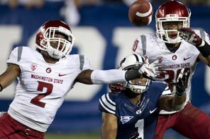 Washington State's Nolan Washington gets a finger on the pass meant for BYU's Ross Apo, who was wrapped up by WSU's Taylor Taliulu. 