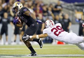 Bishop Sankey escapes the efforts of Stanford's Ed Reynolds, and then breaks free for a 61-yard touchdown in the third quarter that came on a fourth-and-one gamble for Washington.