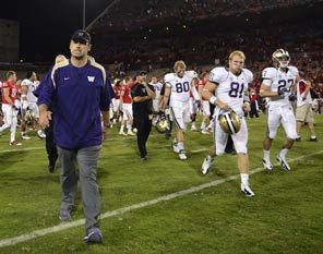 There is no joy for Washington coach Steve Sarkisian as he walks off the field with his team after a 52-17 drubbing in Arizona. 