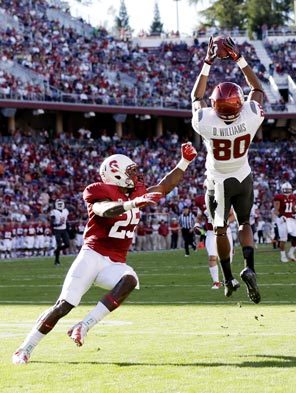 Washington State wide receiver Dominique Williams hauls in a 43-yard reception that helped set up his 3-yard scoring catch. 