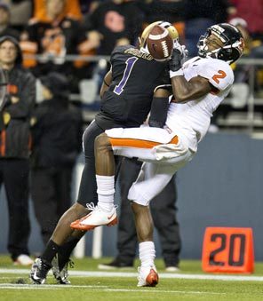 Oregon State receiver Markus Wheaton is leveled by Washington safety Sean Parker, who separates Wheaton from the ball and forces an interception. Wheaton was injured on the play. 