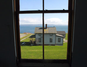 From an upper story of the fort’s 12-bed hospital, there are views of vacation and staff housing and Admiralty Inlet with Whidbey Island beyond.