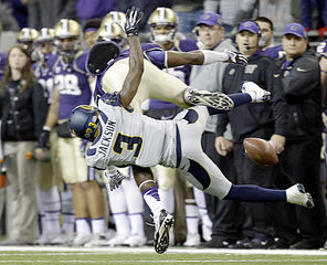 Washington  wide receiver Kasen Williams, top,  gets upended by California’s Kameron Jackson (3) and landed awkwardly in the first half. He was taken to the locker room and could be out for the season with a fractured foot.