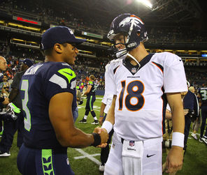  Seahawks QB Russell Wilson, left, greeting  Broncos counterpart Peyton Manning after an exhibition game, faces him again  in the Super Bowl.