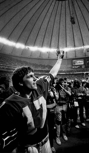 Quarterback Dave Krieg waves to the crowd after directing the Seahawks to their first playoff victory, 31-7 over the Broncos.