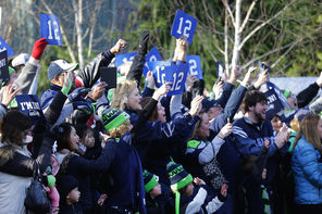 Fans lined the route from the Virginia Mason Athletic Center in Renton to SeaTac airport to see the Seahawks off on Sunday. “It was very collegiate-like,” Pete Carroll said.