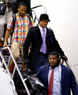 The Seahawks, including quarterback Russell Wilson, center, arrived in Newark on Sunday night.