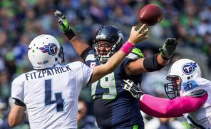 Tennessee Titans Ryan Fitzpatrick gets off a pass under heavy pressure by the Seahawks’ Red Bryant in their October matchup. Bryant joined the team in 2008 during coach Mike Holmgren’s final year.