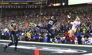   Richard Sherman, center, creates a game-saving interception when he tips a pass intended for 49ers receiver Michael Crabtree in the NFC title game. It was one of just three times Sherman was thrown at in the playoffs.