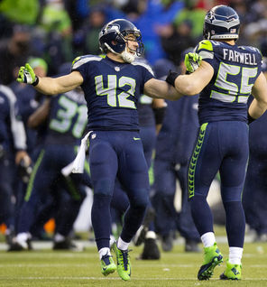 Seattle’s Chris Maragos (42) celebrates another successful special-teams play with teammate  Heath Farwell. Maragos, with his speed and preparation, is a vital part of the Seahawks’ success in special-teams play that has helped the team land a spot in the Super Bowl.