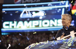 Seahawks  coach Pete Carroll basks in the moment on the podium during the victory celebration after the Seahawks beat the Denver Broncos  in Super Bowl XLVIII.