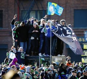 Young fans, some of whom probably skipped school, climbed the parking lot kiosk at CenturyLink Field to see the Seahawks Super Bowl Parade and rally. 