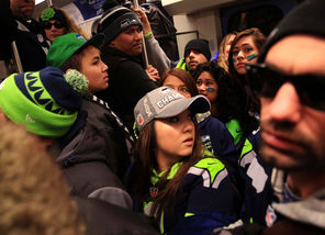  Seahawks fans fill a Link light-rail train traveling from Beacon Hill to the stadium district for the Seahawks victory parade Wednesday.
