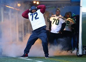 Seattle Seahawks defensive end Michael Bennett plays to the cheering crowd as he is introduced Wednesday at CenturyLink Field.