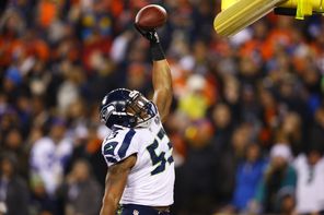 Seahawks linebacker Malcolm Smith  celebrates after his pick-six in the Super Bowl against the Denver Broncos, which helped earn him the MVP trophy.