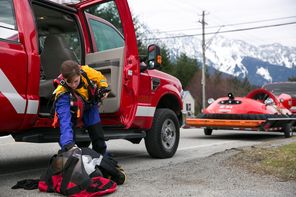  Rescue worker Danielle Rivera get her equipment ready before heading out from Darrington.
