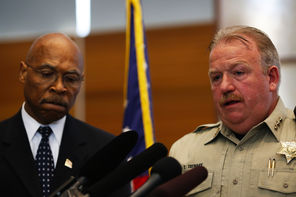 Snohomish County Sheriff Ty Trenary, right, and County Executive John Lovick address a news conference Monday in Everett announcing the end of active search efforts in the Oso landslide zone.