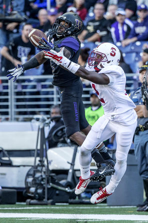   Kasen Williams, left, comes down with a one-handed catch against Stanford’s Wayne Lyons for his only reception of the game. The 14-yard gain came in the first quarter.