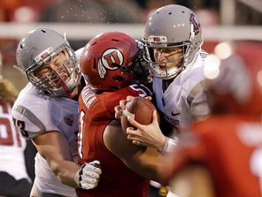 Washington State quarterback Connor Halliday, right, is sacked by Utah defensive end Jason Fanaika  (51) during the second quarter.