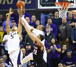 Washington guard Nigel Williams-Goss (5) and Washington center Robert Upshaw, center, go up for the ball  during the second half. 