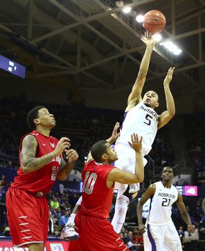 Washington guard Nigel Williams-Goss fires off a shot over Stony Brook guard Carson Puriefoy (10) that misses its mark in the second half. UW shot just 34.3 percent. 